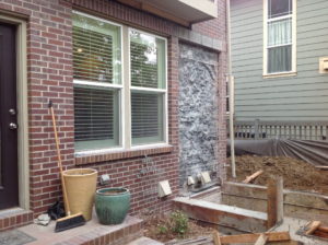 Brick peeled off of house where addition will be connected to house.