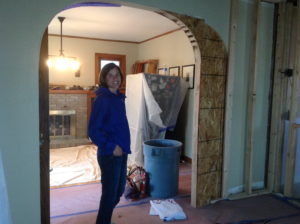 Mary enjoys the construction progress. The archway was made slightly smaller to allow for a TV wall in the new sitting room.